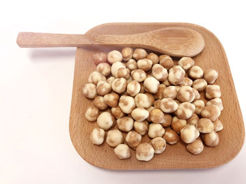 El sabor del Wasabi cubrió los garbanzos crujientes picantes escogió buen gusto a dedo en bolso del minorista